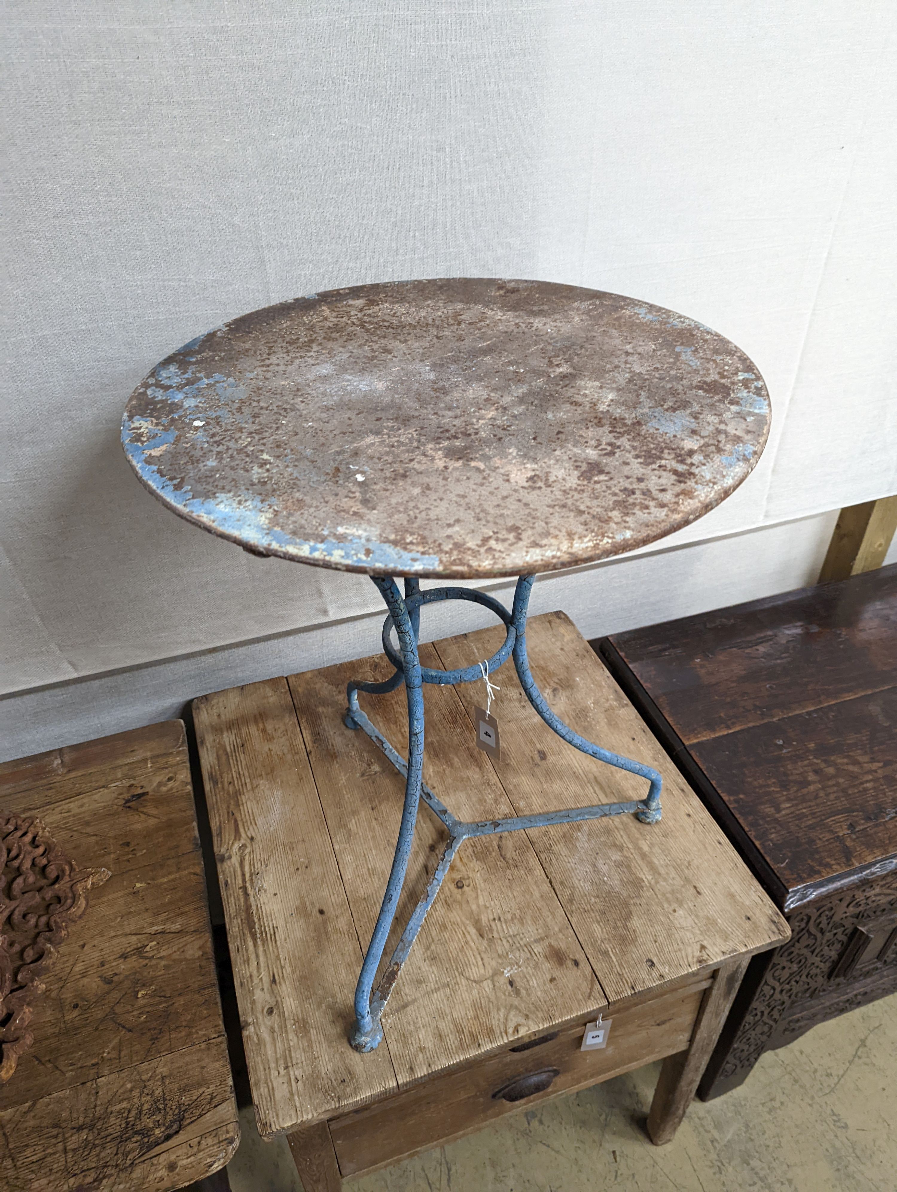 A French wrought iron garden table. W-55cm, D-55cm, H-69cm.